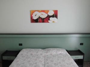 Postel nebo postele na pokoji v ubytování Hotel Palm Beach