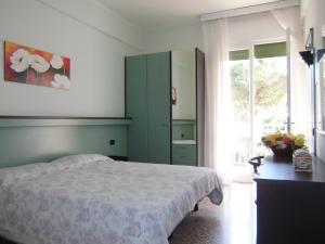 Postel nebo postele na pokoji v ubytování Hotel Palm Beach