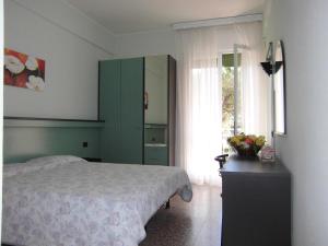 Postel nebo postele na pokoji v ubytování Hotel Palm Beach
