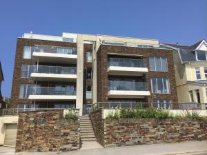 an apartment building with a staircase in front of it at Azure 7 Apartment in Newquay