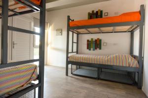 Ένα ή περισσότερα κρεβάτια σε δωμάτιο στο Bernardino Hostel Boutique