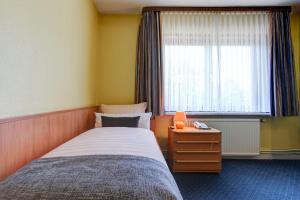 Ένα ή περισσότερα κρεβάτια σε δωμάτιο στο Hotel Elbinsel free parking