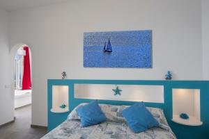 En eller flere senge i et værelse på Casa Mimi