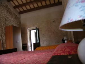Postel nebo postele na pokoji v ubytování Masseria del Ponte