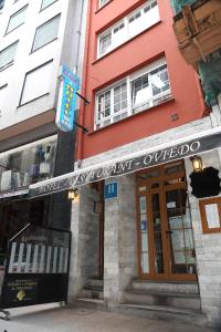 a building with a sign on the front of it at Hotel Restaurante Oviedo in Luarca +21 photos