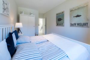 Posteľ alebo postele v izbe v ubytovaní Widok na Mazury Apartament przy Porcie