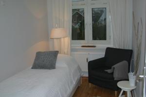 Ein Bett oder Betten in einem Zimmer der Unterkunft Haus MeerZeit