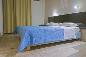 Postel nebo postele na pokoji v ubytování Polyxeni Hotel