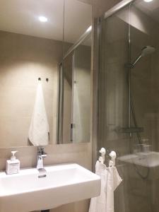 a bathroom with a sink and a shower at Apartment P 35 in Dubrovnik