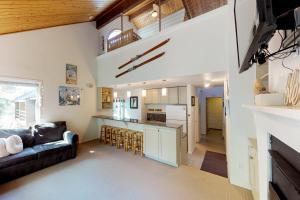 a large living room with a couch and a kitchen at Snowbird Condo #170-D in Girdwood