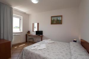 Postel nebo postele na pokoji v ubytování B&B Monelli