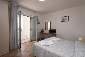Postel nebo postele na pokoji v ubytování B&B Monelli