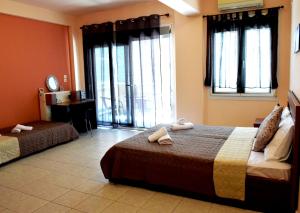 A bed or beds in a room at Arianna Studios 7