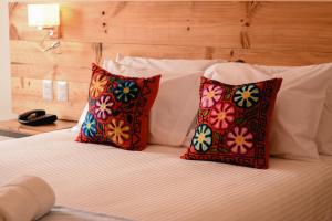 Cama ou camas em um quarto em Cooper Hotel Boutique