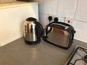 a toaster sitting on top of a kitchen counter at Islington Apartments in London