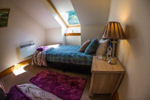 a small bedroom with a bed and a window at Mulberry in Nairn