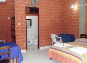 Postel nebo postele na pokoji v ubytování Hotel Ambaibo