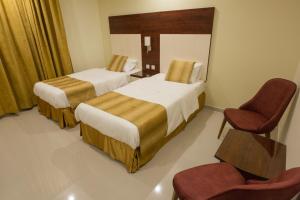 Ένα ή περισσότερα κρεβάτια σε δωμάτιο στο Farha International Residential Units