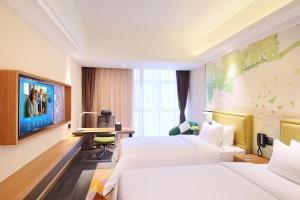 Letto o letti in una camera di Hampton by Hilton Zhuhai Cheng Feng Plaza