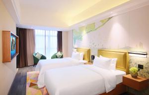 Letto o letti in una camera di Hampton by Hilton Zhuhai Cheng Feng Plaza