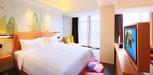 Letto o letti in una camera di Hampton by Hilton Zhuhai Cheng Feng Plaza