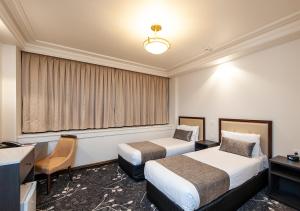 Burke and Wills Hotel Toowoomba客房内的一张或多张床位