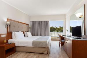 TV a/nebo společenská místnost v ubytování Best Western Plus Hotel Plaza