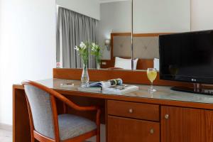 TV a/nebo společenská místnost v ubytování Best Western Plus Hotel Plaza