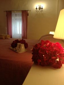 A bed or beds in a room at Il Gallo Del Vicino