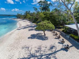 an overhead view of a beach with benches and the ocean at Eratap Beach Resort in Port Vila