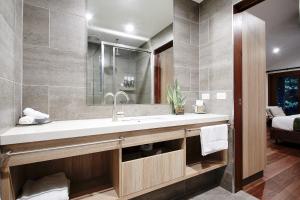 a bathroom with a sink and a mirror at Daintree Ecolodge in Daintree