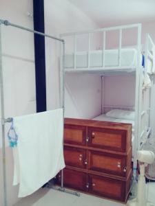 a bedroom with a bunk bed and a wooden dresser at Sangchan hostel in Ko Lipe +22 photos