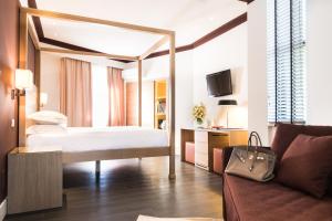 Postel nebo postele na pokoji v ubytování Hotel Michelangelo & Day SPA