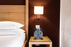 Postel nebo postele na pokoji v ubytování Hotel Michelangelo & Day SPA