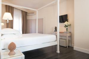 Postel nebo postele na pokoji v ubytování Hotel Michelangelo & Day SPA
