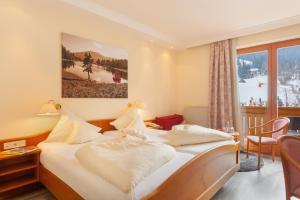 Ein Bett oder Betten in einem Zimmer der Unterkunft Family & Sporthotel Kärntnerhof