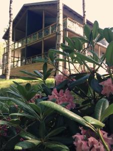 a building with a bunch of flowers in front of it at SResort Family Apartment in Imatra