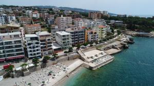 an aerial view of a city with a beach and buildings at Apartments Palma in Dobra Voda
