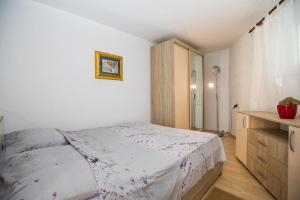 Postel nebo postele na pokoji v ubytování Madonna Field Apartment