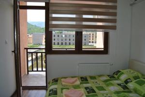 Una cama o camas en una habitación de Apartmani Aura
