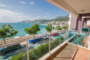a balcony with a view of the ocean at Apartments Palma in Dobra Voda