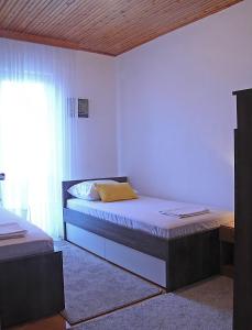 Posteľ alebo postele v izbe v ubytovaní Villa Perla