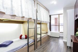 a bunk bed room with two bunk beds at Barcelona & You Hostel Sagrada Familia in Barcelona