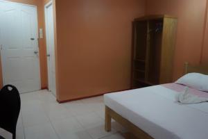 Postel nebo postele na pokoji v ubytování Lylie Hotel