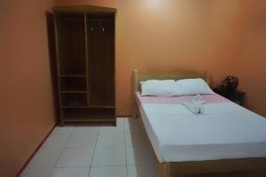 Postel nebo postele na pokoji v ubytování Lylie Hotel