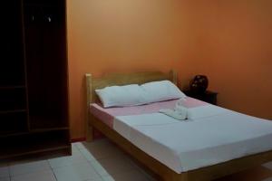 Postel nebo postele na pokoji v ubytování Lylie Hotel