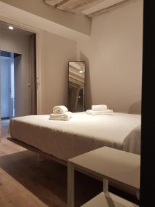 Postel nebo postele na pokoji v ubytování CORTE SCONTA Mini-Loft