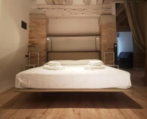 Postel nebo postele na pokoji v ubytování CORTE SCONTA Mini-Loft