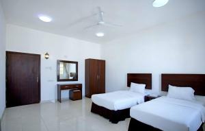 Postel nebo postele na pokoji v ubytování Star Emirates Furnished Apartments 2