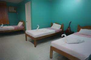 Postel nebo postele na pokoji v ubytování Lylie Hotel